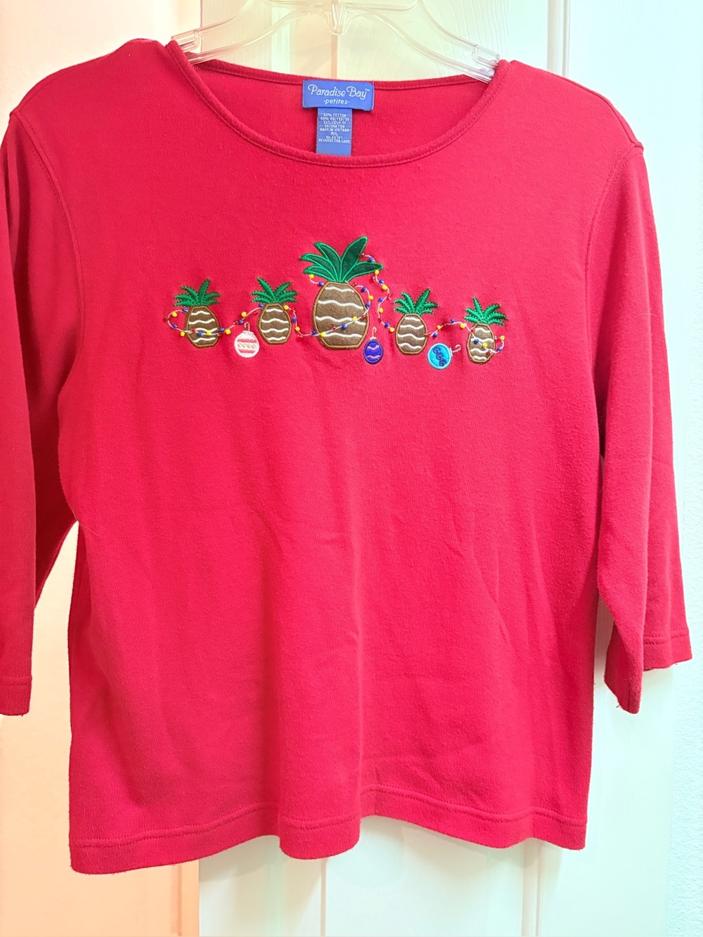 Holiday women’s T-shirt with embroidered holiday pineapples
